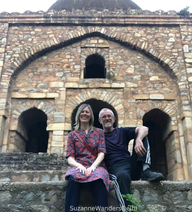 the author and friend sitting on stone steps outside Bara Khamba in Green Park