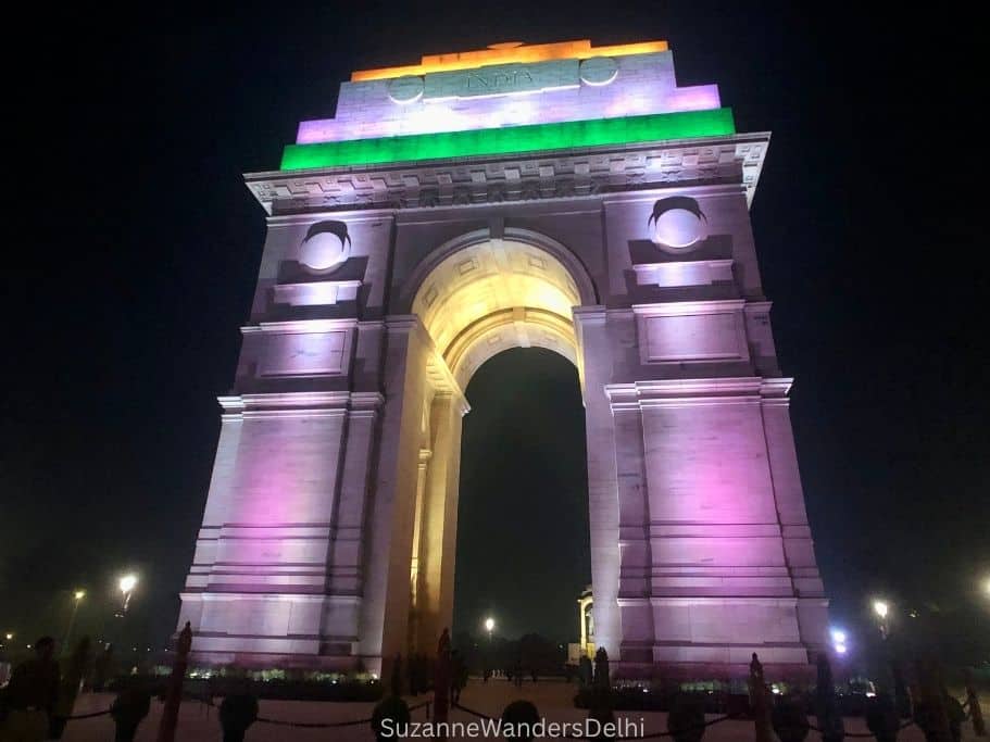 India Gate at night lit up in the colours of the Indian flag, one of the things to do in Delhi