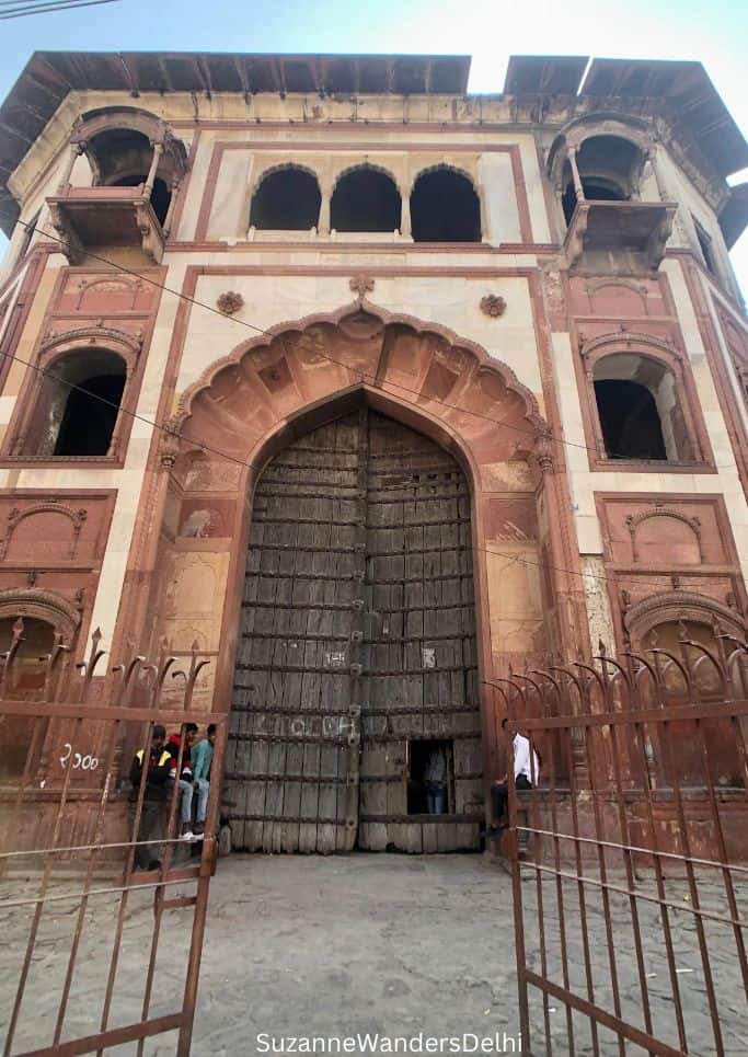huge wooden doors at entrace of Zafar Mahal in Mehrauli, one of the urban villages in Delhi