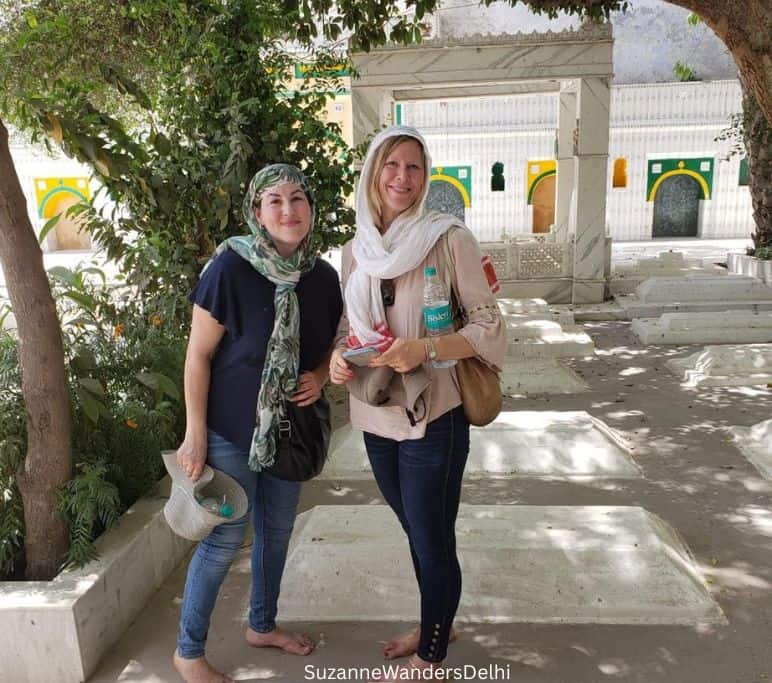 two women with head scarves at Hirjon ka Khanqah in Mehrauli Urban Village