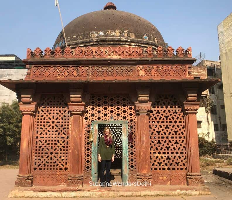 Tomb of Shaikh Yusuf Qattal in Khirki Village with woman standing in entrance way
